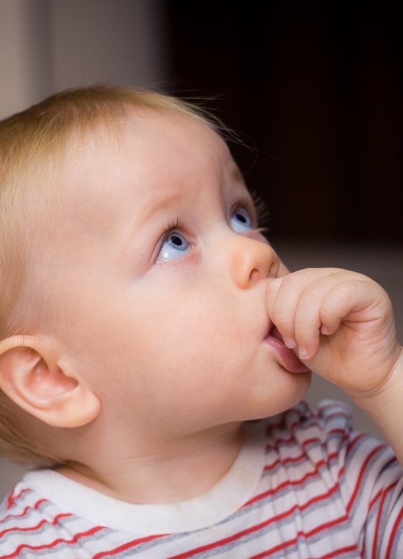 baby sucking their thumb