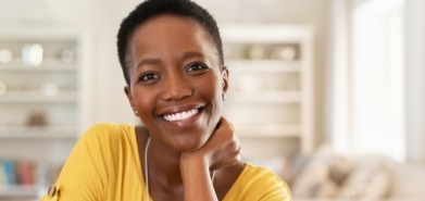 Woman in yellow blouse smiling