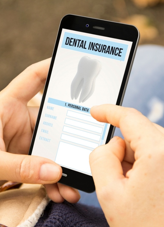Person filling out dental insurance form on their phone