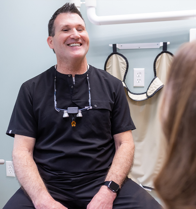 Person pointing to red spot in their gums before gum disease treatment in Jonesboro