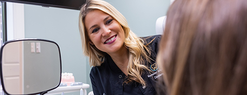 Man in dental chair laughing with his Jonesboro dentist