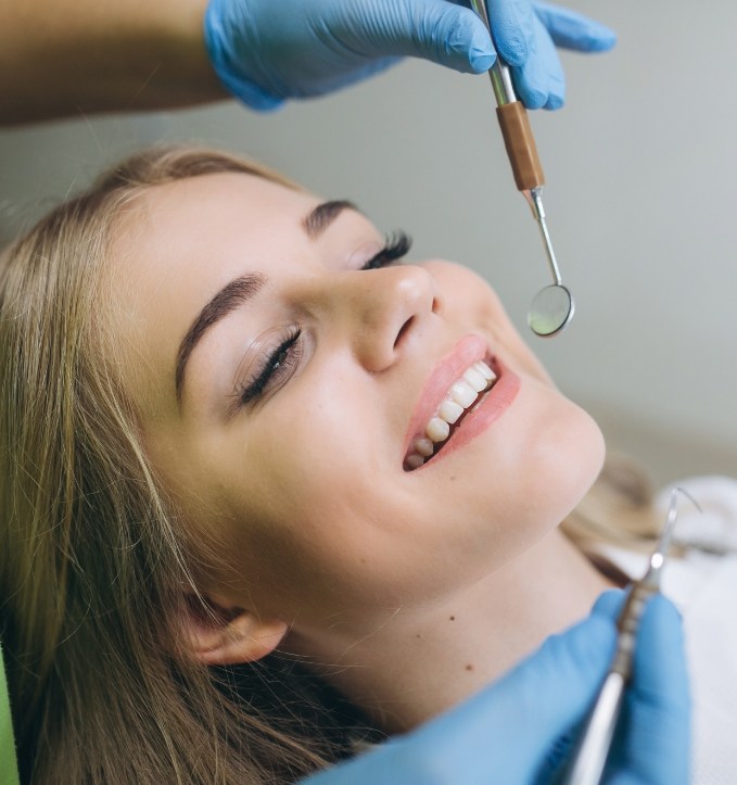 Woman receiving a preventive dentistry checkup in Jonesboro